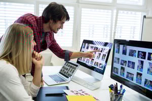 male-female-graphic-designers-interacting-computer male-female-graphic-designers-interacting-computer